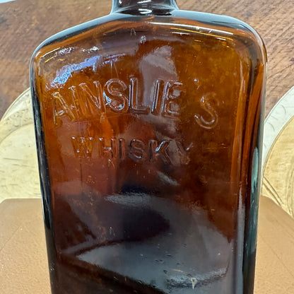 Ainslie’s Amber Whisky Bottle