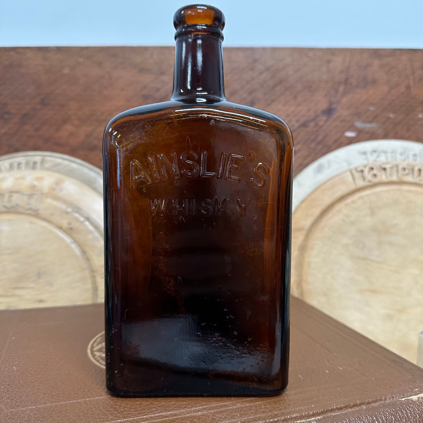 Ainslie’s Amber Whisky Bottle